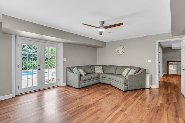 268 Antrim, Moore, SC 29369 - unfurnished living room featuring baseboards, ceiling fan, french doors, and light wood-style floors