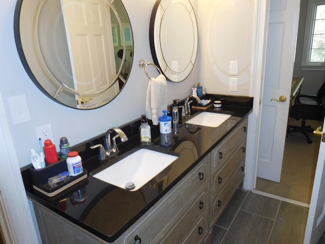 bathroom with double vanity and a sink