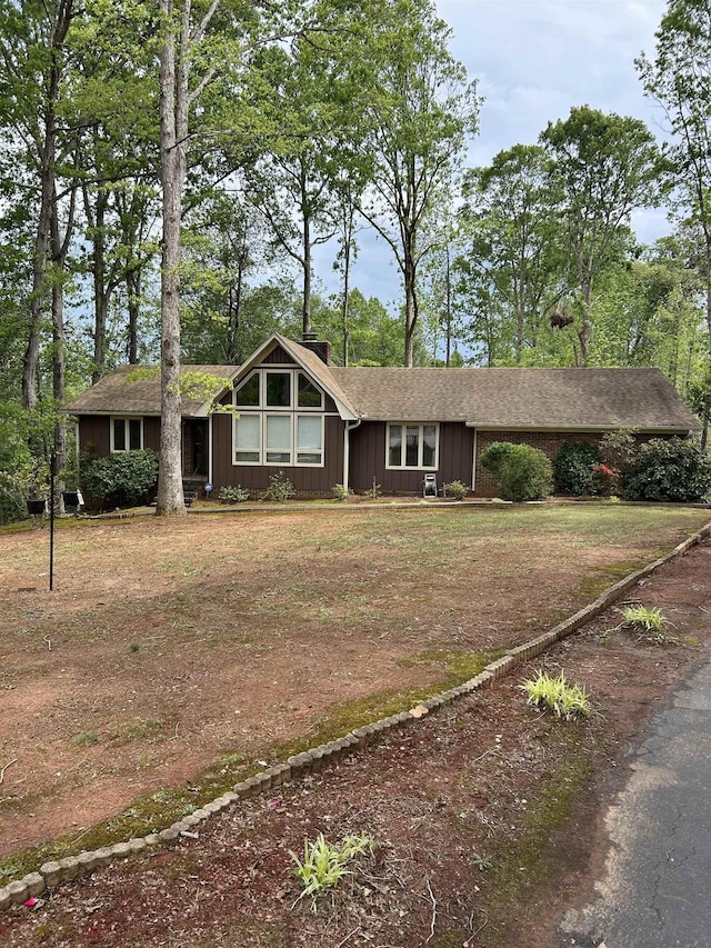 ranch-style home featuring a carport
