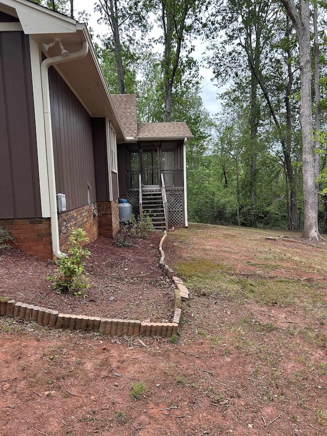 view of yard with a sunroom
