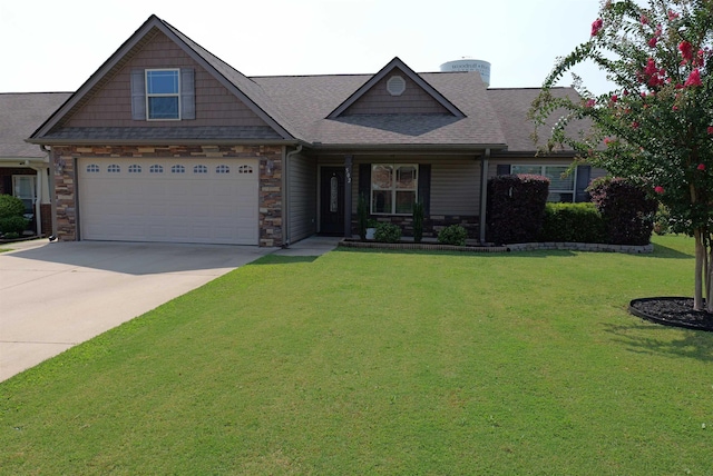 craftsman-style home with roof with shingles, stone siding, a front yard, and concrete driveway