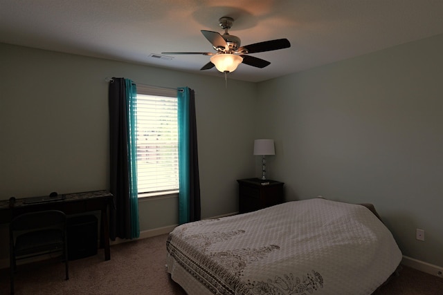 bedroom featuring baseboards, carpet, a ceiling fan, and visible vents