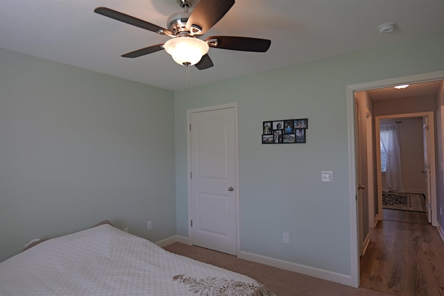 bedroom featuring baseboards and ceiling fan