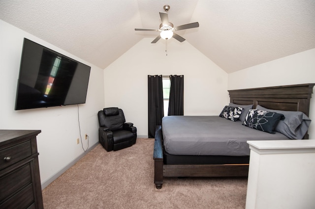 bedroom featuring carpet floors, a ceiling fan, a textured ceiling, and vaulted ceiling