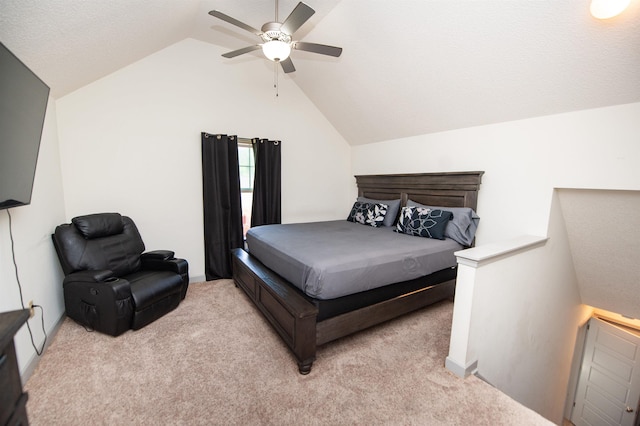bedroom featuring ceiling fan, vaulted ceiling, and light carpet