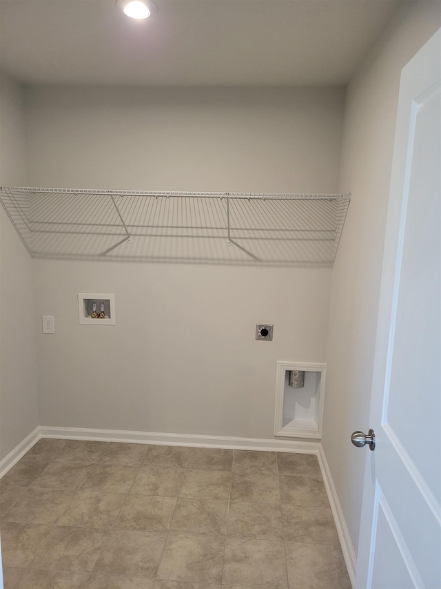laundry area with baseboards, hookup for an electric dryer, laundry area, and hookup for a washing machine
