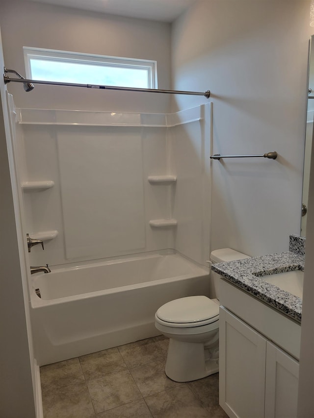 bathroom with toilet, tile patterned floors, bathing tub / shower combination, and vanity
