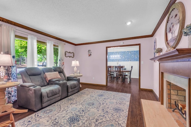 244 Brittany, Gaffney, SC 29341 - living room with dark wood-style flooring, a textured ceiling, crown molding, a fireplace, and baseboards