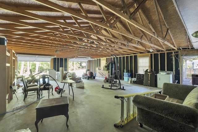 interior space with washer / dryer and concrete floors