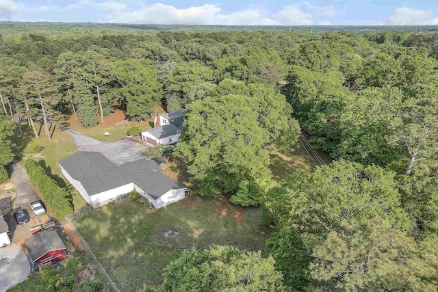 drone / aerial view featuring a forest view