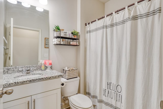 full bath with toilet and vanity
