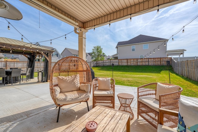 view of patio / terrace with a gazebo, outdoor dining area, a fenced backyard, and an outdoor living space