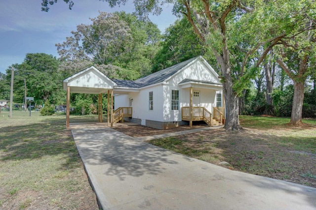 bungalow with a front yard, driveway, and crawl space