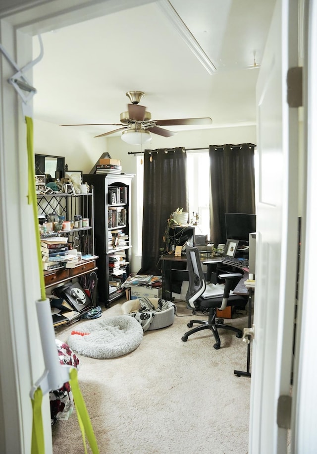 office with carpet floors and a ceiling fan