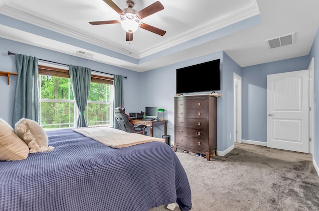 carpeted bedroom featuring crown molding, baseboards, ceiling fan, and visible vents