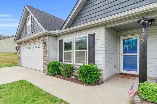 view of home's exterior featuring a shingled roof, driveway, and stone siding