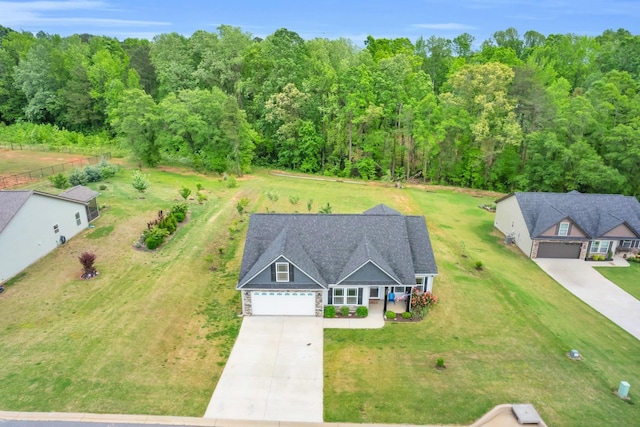 aerial view featuring a wooded view