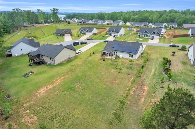birds eye view of property with a residential view