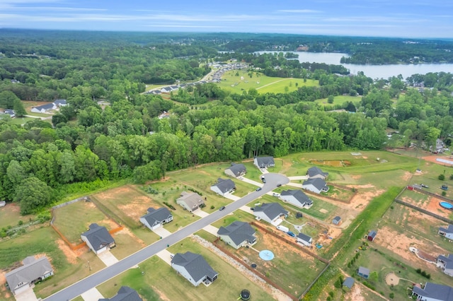 bird's eye view featuring a water view and a view of trees