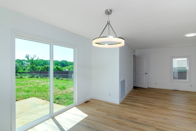 583 Berry, Boiling Springs, SC 29316 - unfurnished dining area with plenty of natural light, light wood finished floors, baseboards, and visible vents