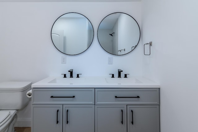 583 Berry, Boiling Springs, SC 29316 - bathroom featuring double vanity, toilet, and a sink