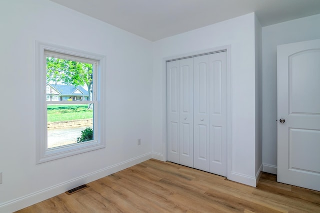 583 Berry, Boiling Springs, SC 29316 - unfurnished bedroom with baseboards, a closet, light wood finished floors, and visible vents