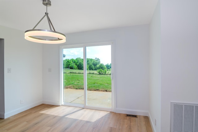583 Berry, Boiling Springs, SC 29316 - doorway to outside featuring visible vents, light wood-style flooring, and baseboards
