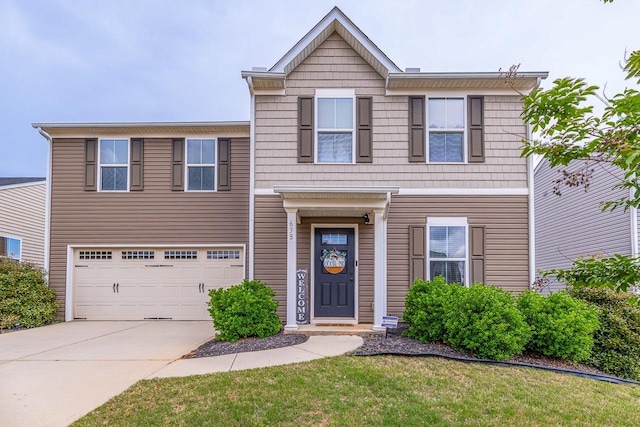 traditional home with an attached garage, driveway, and a front lawn