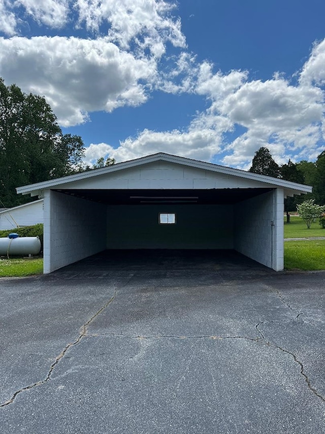 garage featuring aphalt driveway