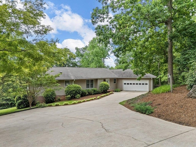 single story home with an attached garage and driveway