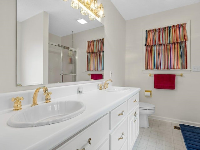 full bath with tile patterned floors, toilet, a stall shower, and a sink