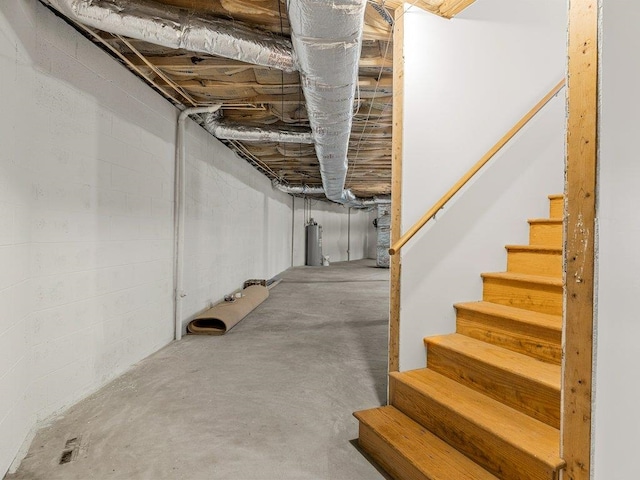 unfinished below grade area with stairway and water heater