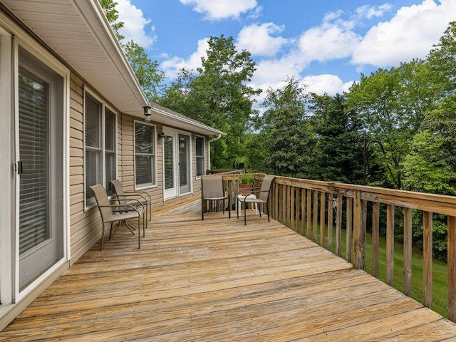 wooden terrace with outdoor dining area