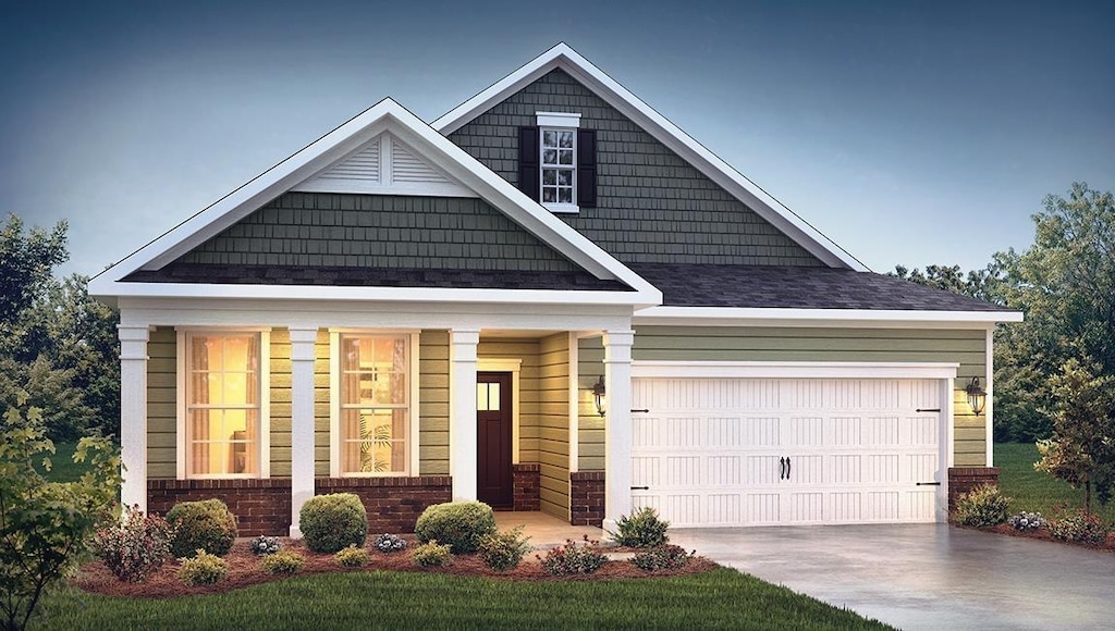 craftsman-style house featuring concrete driveway and a garage