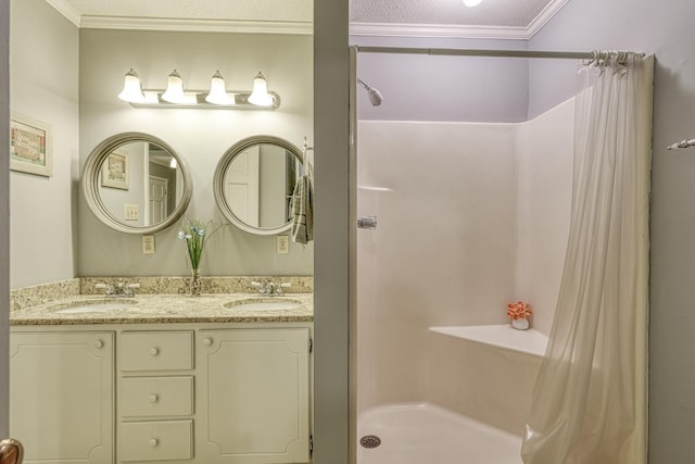full bath featuring a shower stall, crown molding, a sink, and double vanity