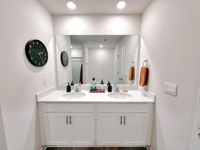 bathroom featuring double vanity and a sink