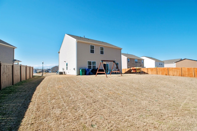 back of property with fence