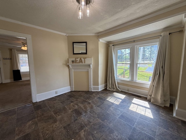 interior space with baseboards, ornamental molding, stone finish flooring, and a textured ceiling