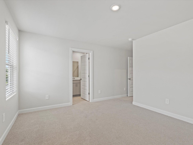 114 Arrow, Greer, SC 29651 - unfurnished bedroom featuring light colored carpet, baseboards, ensuite bath, and recessed lighting