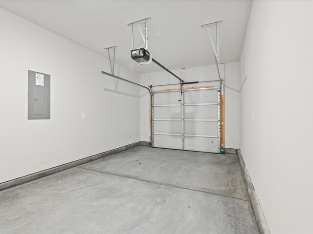 114 Arrow, Greer, SC 29651 - garage with electric panel, a garage door opener, and baseboards