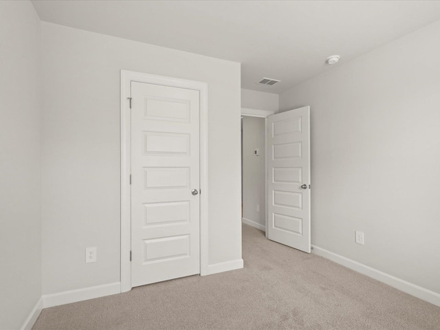 124 Arrow, Greer, SC 29651 - unfurnished bedroom with light colored carpet and baseboards