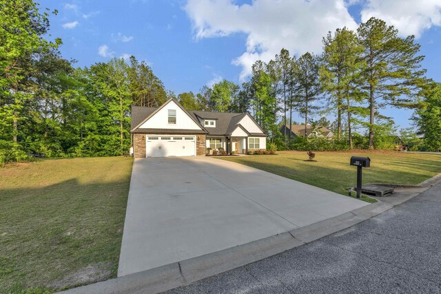 555 Canewood, Campobello, SC 29322 - view of front of property with concrete driveway, a front yard, and brick siding