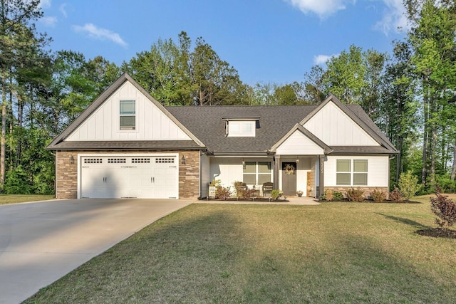 555 Canewood, Campobello, SC 29322 - view of front of property with board and batten siding, stone siding, driveway, and a front yard