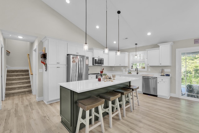 555 Canewood, Campobello, SC 29322 - kitchen with white cabinets, stainless steel appliances, and baseboards