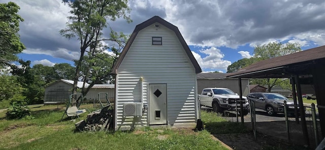 view of outbuilding with cooling unit and an outdoor structure