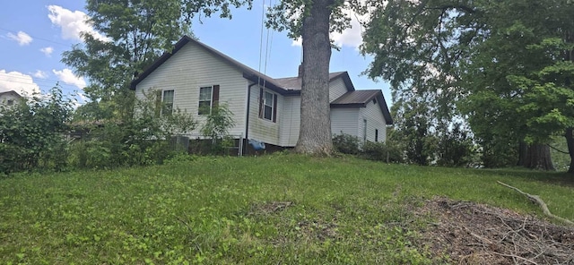 view of home's exterior featuring a lawn
