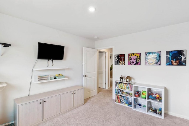 game room featuring light colored carpet