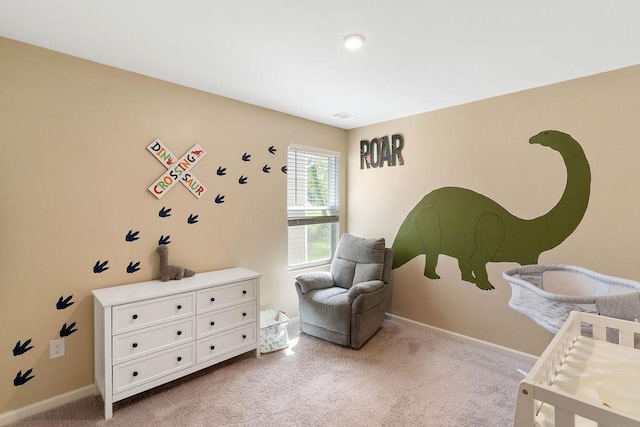 carpeted bedroom with visible vents and baseboards