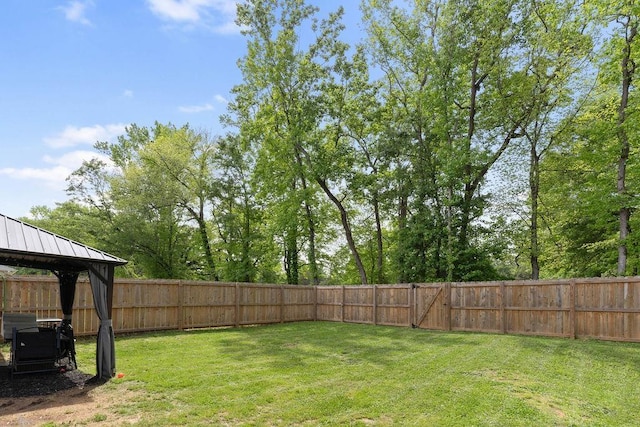 view of yard with a gazebo and a fenced backyard