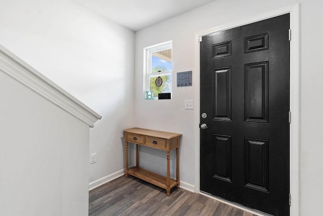 entrance foyer featuring baseboards and dark wood-style floors